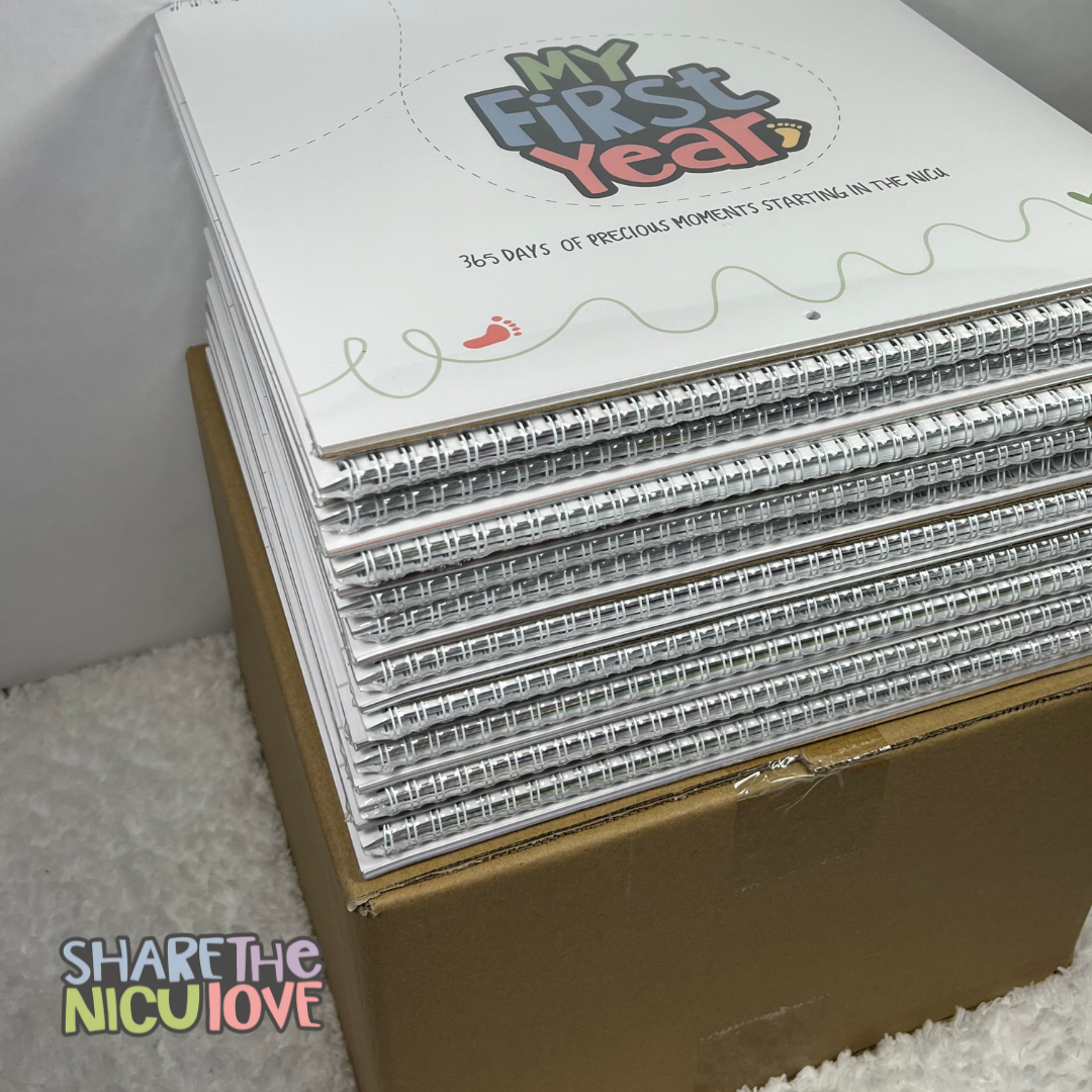 Case of My First Year NICU Baby Calendar with 20 calendars stacked on top of the box. "Share the NICU Love" bulk discount program logo overlaid.