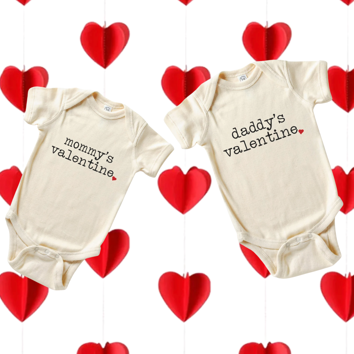 A valentine's day preemie onesie with the words "Mommy's valentine" and another nicu baby onesie with the words "daddys valentine" over strands of red heart garland