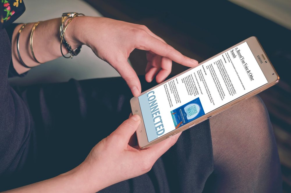 NICU mom holding tablet displaying free ebook 20 great ways to bond with your baby in the NICU