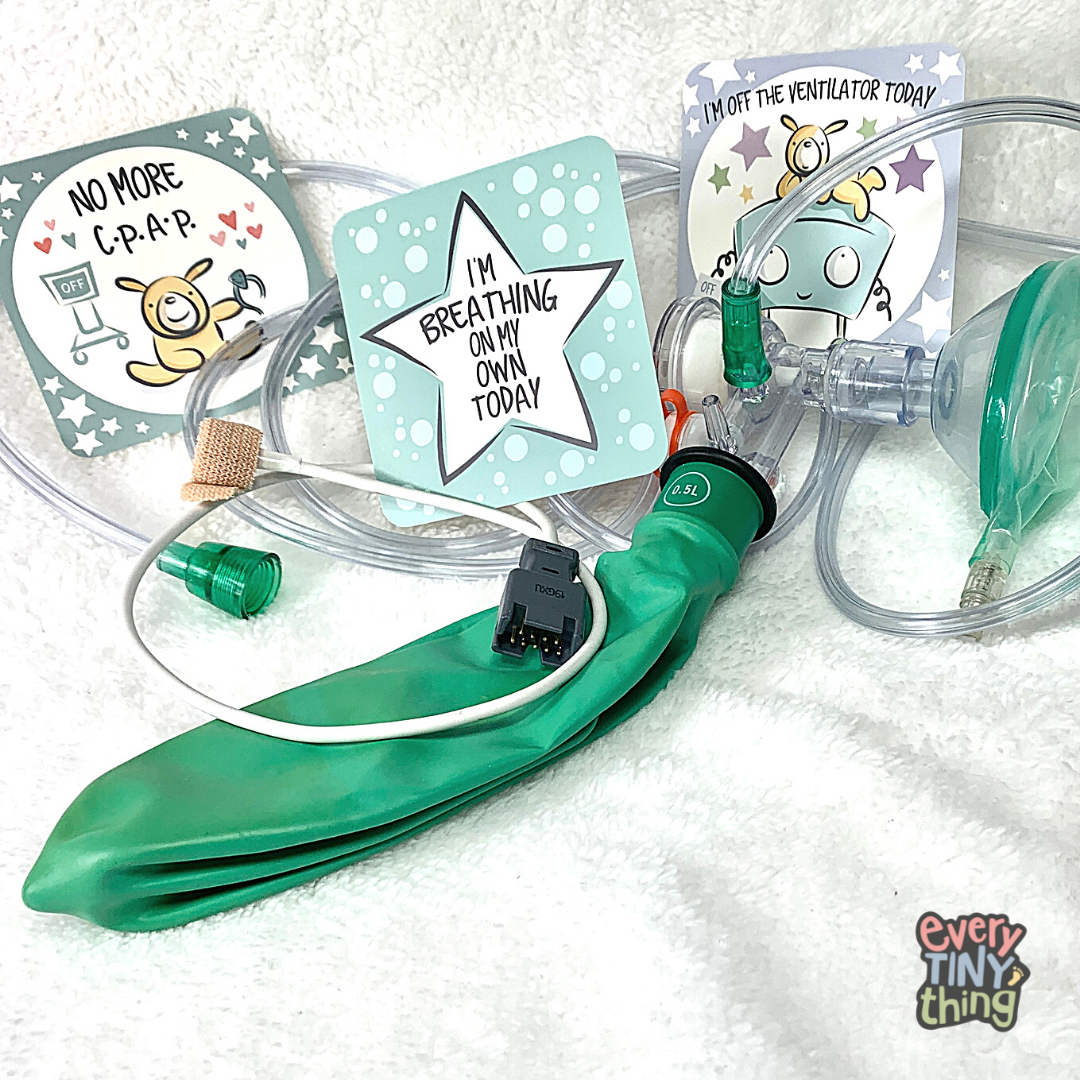 NICU milestone photo cards "no more CPAP" "I"m breathing on my own today" and "i'm off the ventilator today" displayed with NICU preemie baby oxygen mask ambu bag and baby pulse ox cable on white background with every tiny thing NICU specialty store logo overlaid