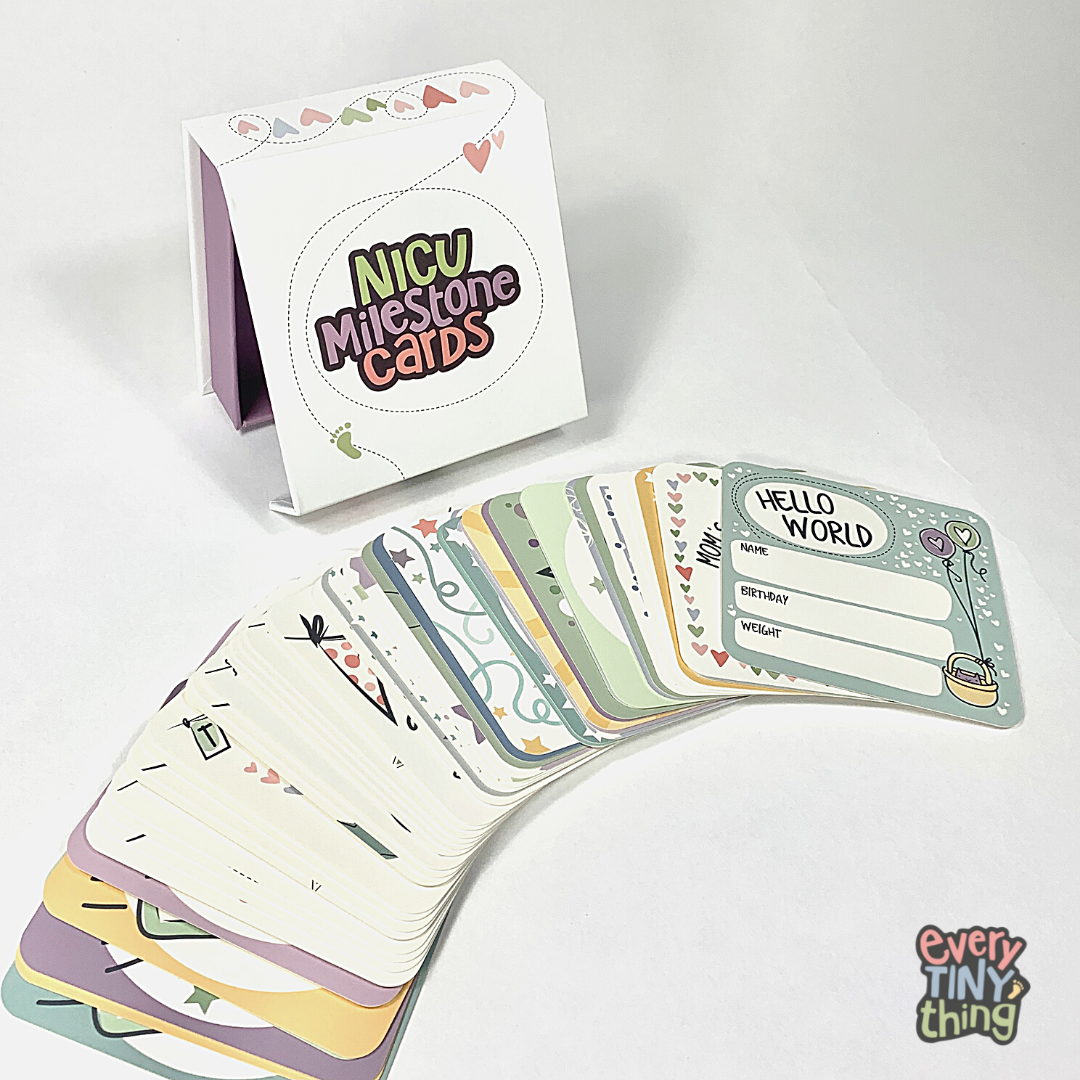 NICU Milestone Cards laid out in front of NICU Milestone Card box on white background with Every Tiny Thing NICU Store Logo overlaid